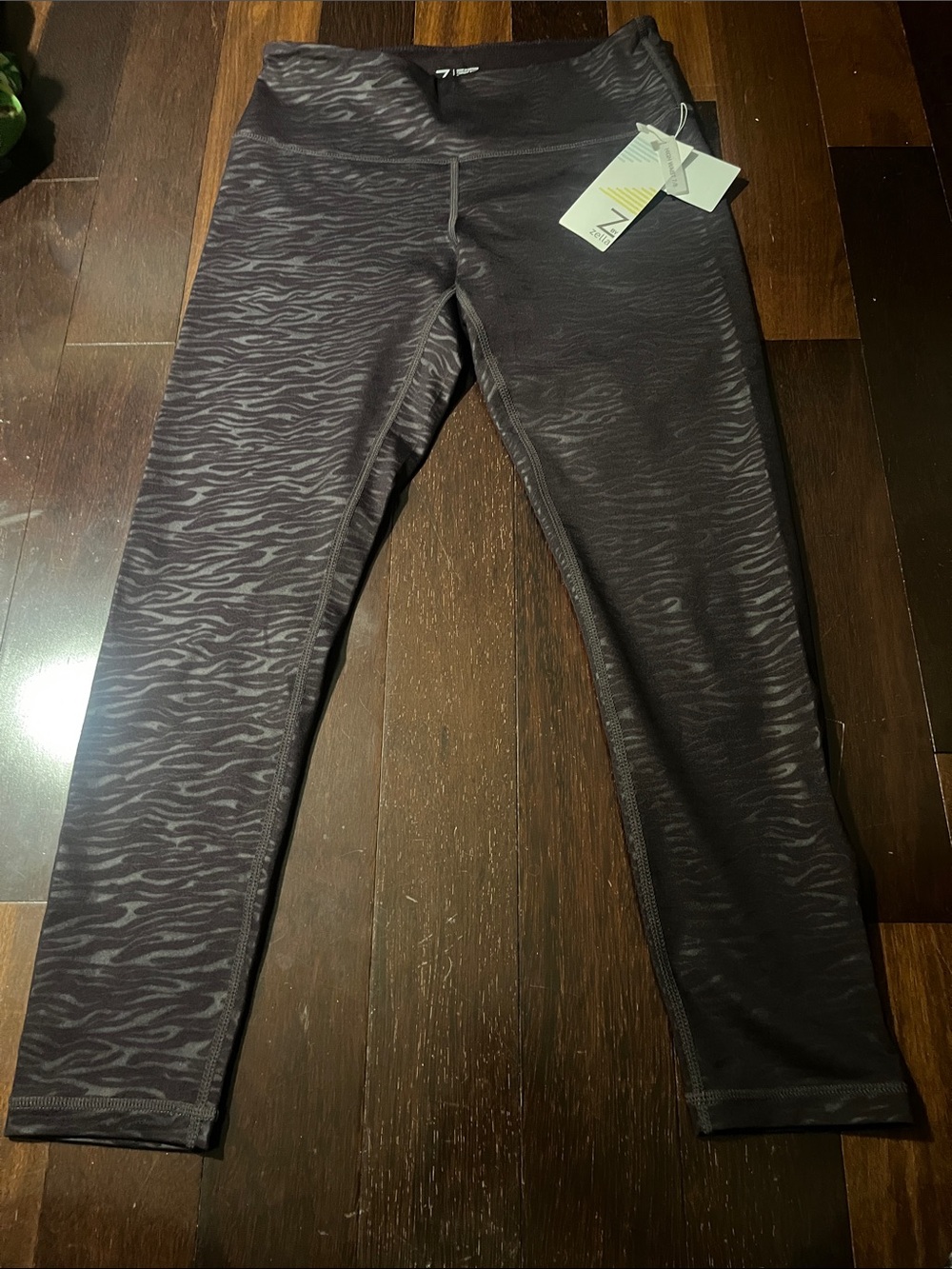 NWT women’s Performance Leggings - plum Zebra Print